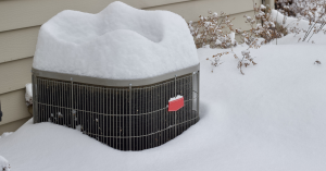 Air conditioner covered in snow